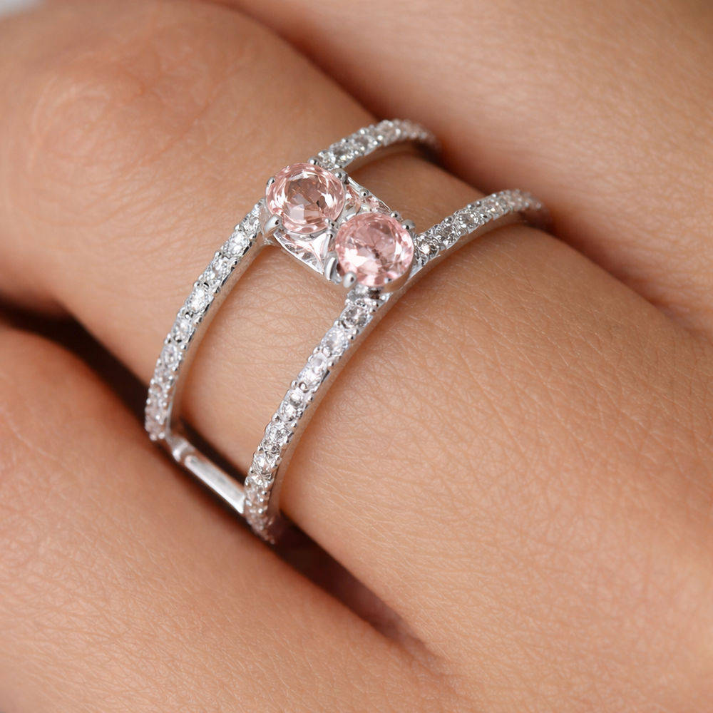 Double band lab-grown diamond ring with two round pink gemstones on finger