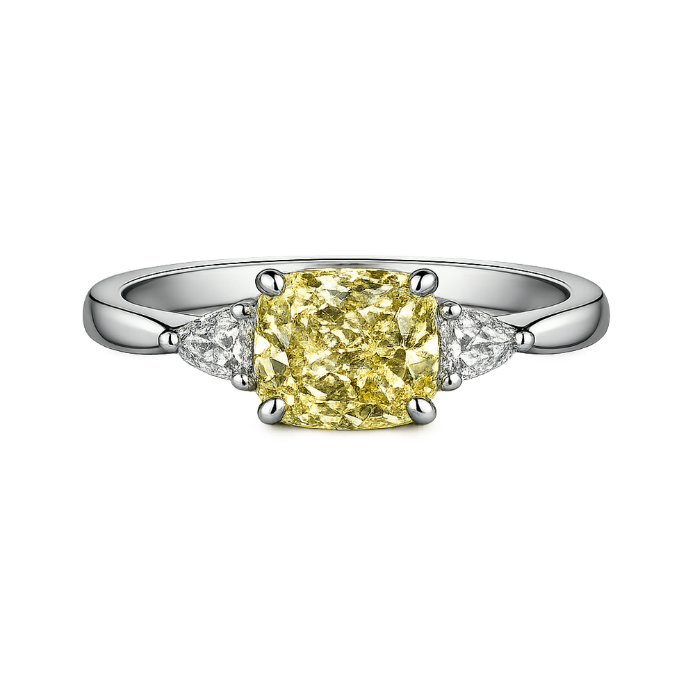 Cushion cut yellow lab-grown diamond ring with white side stones on platinum band