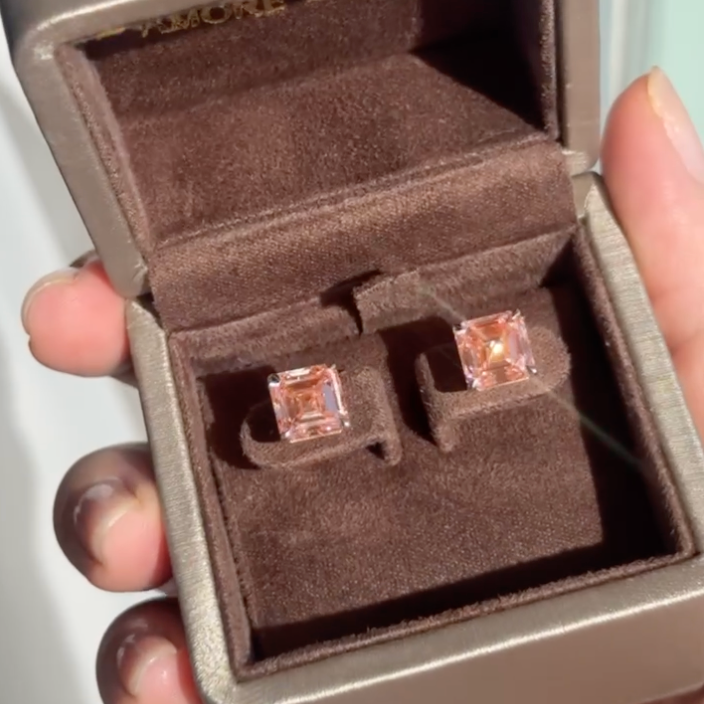 Square cut pink lab-grown diamond earrings in a brown velvet jewelry box