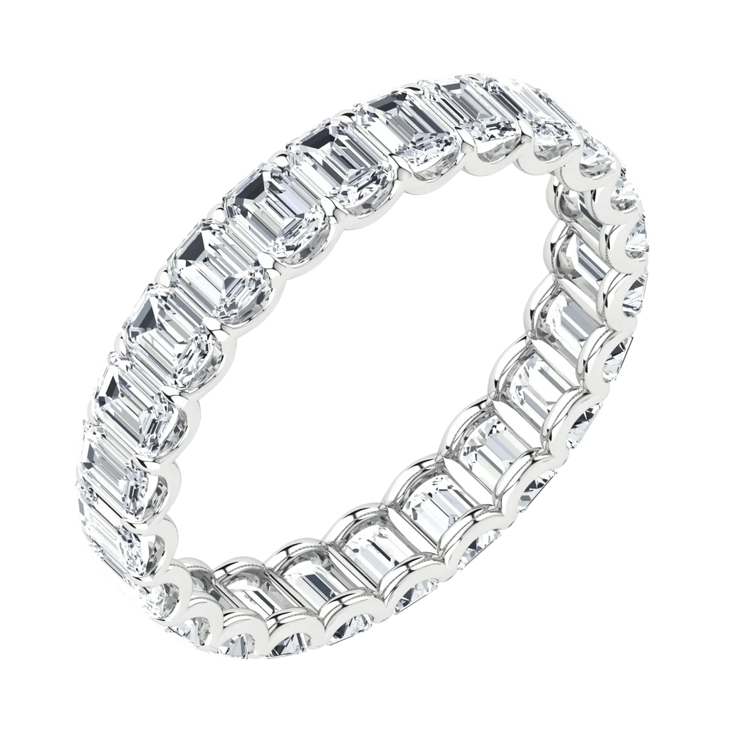 Lab-grown diamond eternity ring with emerald-cut stones set in white metal on black background