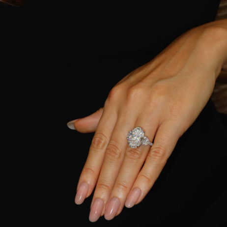 8 Ct center stone Oval lab grown diamond ring with 0.70 ct heart shape side diamonds