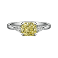 Cushion cut yellow lab-grown diamond ring with white side stones on platinum band