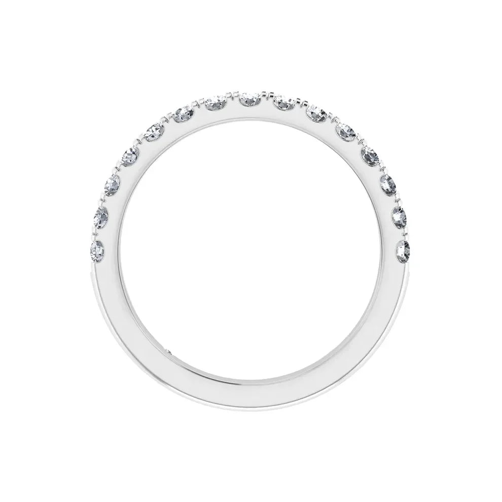 White gold lab-grown diamond eternity band with round-cut stones on a white background