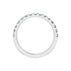 White gold lab-grown diamond eternity band with round-cut stones on a white background