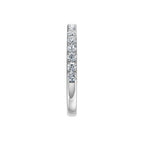 Lab-grown diamond eternity ring in white gold, minimalist band design on white background