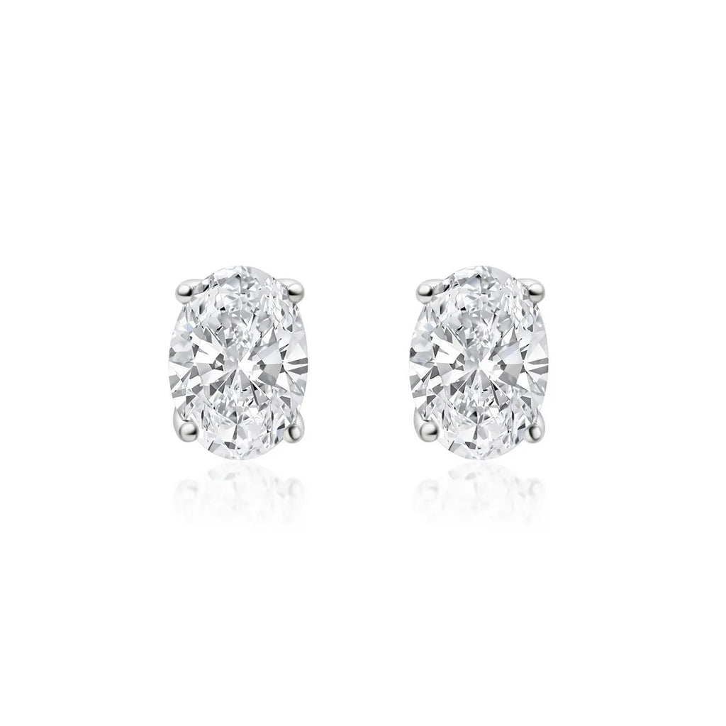 Oval cut lab-grown diamond stud earrings on white background
