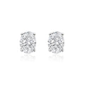 Oval cut lab-grown diamond stud earrings on white background