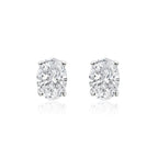 Oval cut lab-grown diamond stud earrings on white background