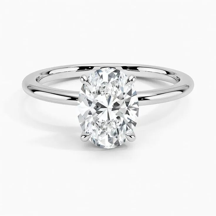 Oval cut lab-grown diamond solitaire ring on white gold band, minimalist jewelry