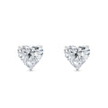 Heart-shaped lab-grown diamond stud earrings with white gold prongs on white background