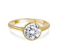 Gold ring with large round lab-grown diamond solitaire on white background