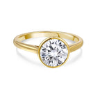Gold ring with large round lab-grown diamond solitaire on white background