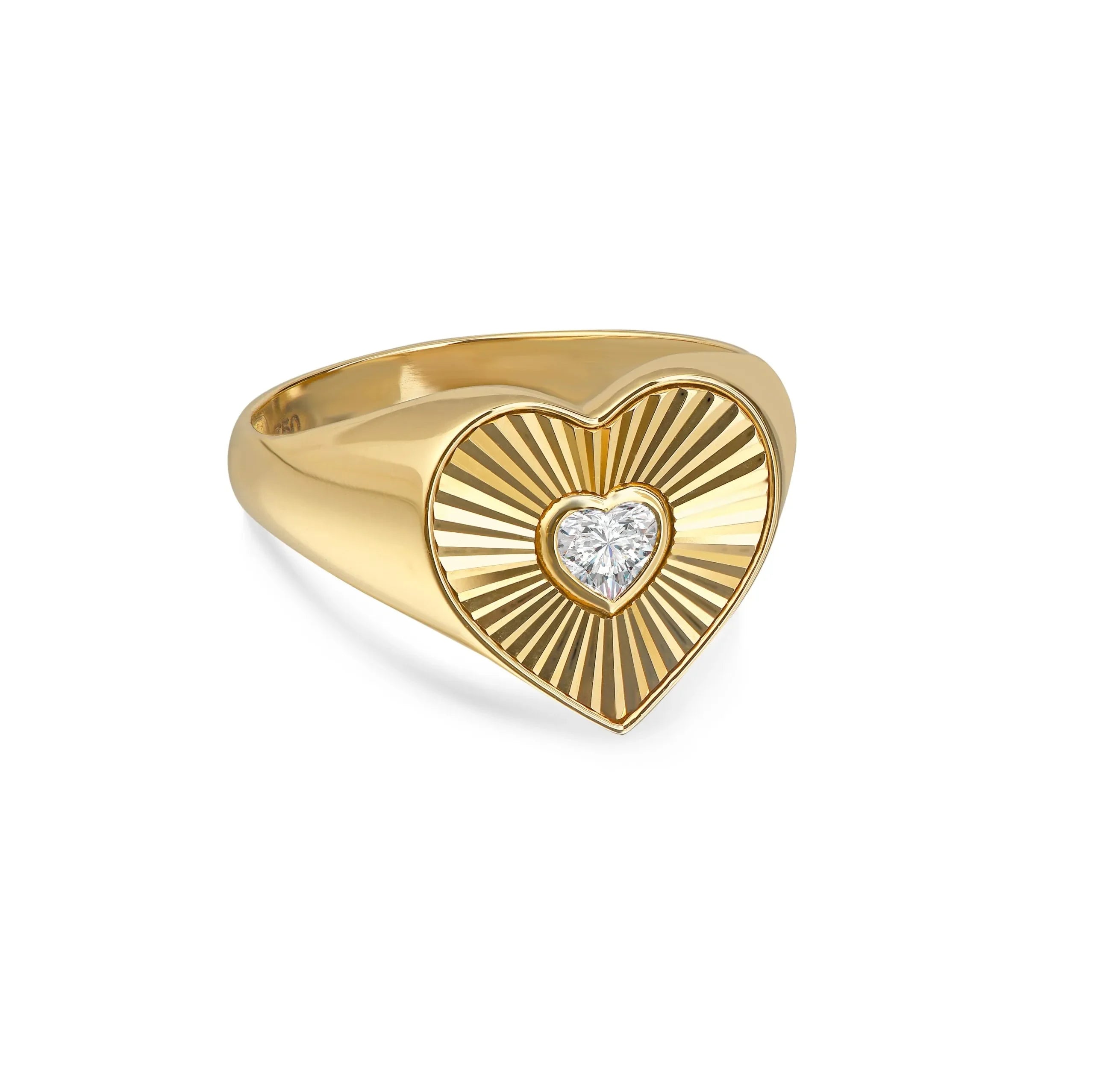 Gold heart-shaped ring with a central lab-grown diamond and radiant engraved pattern