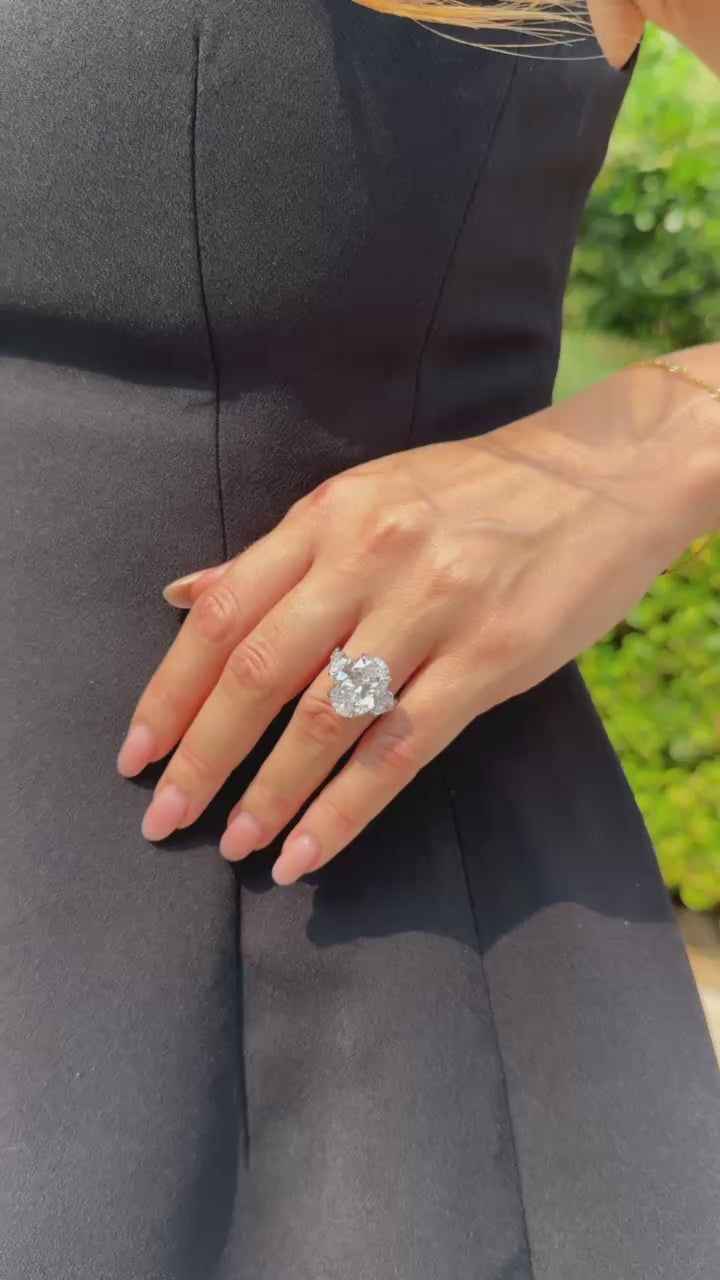 8 Ct center stone Oval lab grown diamond ring with 0.70 ct heart shape side diamonds